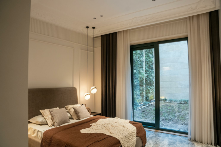 A modern hotel room featuring elegant decor and a cozy atmosphere.